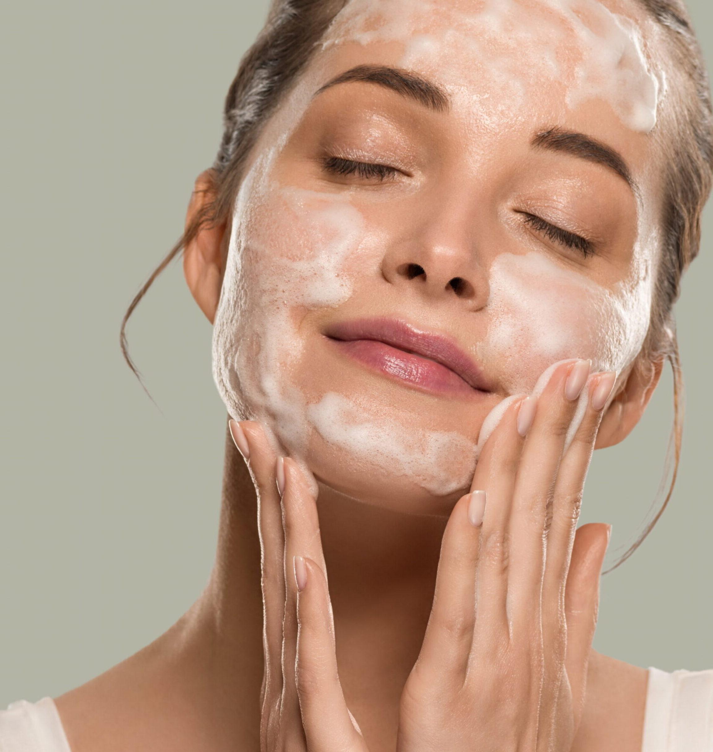 Woman applying medical grade skincare products to improve dull skin